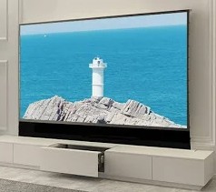 Écran motorisé au sol repliable, déploiement vertical automatique pour projection nomade haut de gamme.